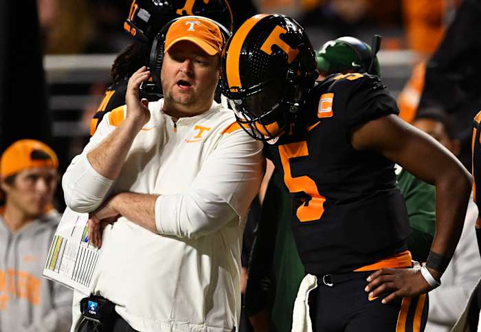 Josh Heupel talks through a play with QB Hendon Hooker.